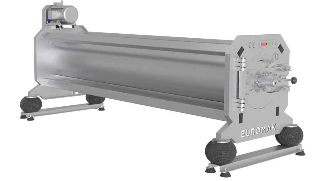 A large industrial rug centrifuge machine with a stainless steel drum and a pneumatic cover locking system.